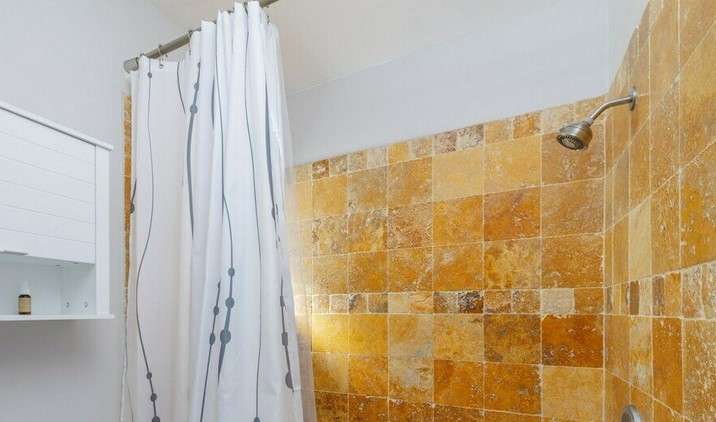 Should Shower Curtain Cover Shower Head?