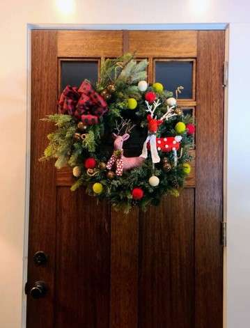 Get Festive: 15 Christmas Décor Ideas for Living Room Bliss 7 Hang a Wreath on the Door