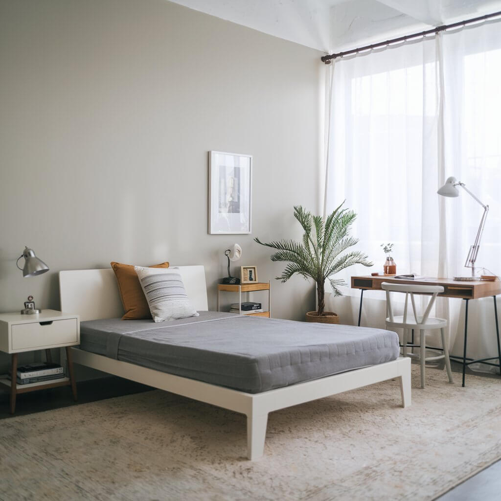 12 Stunning Urban Bedroom Ideas You Need to Try 8 Explore urban bedroom ideas featuring minimalist decor that emphasizes clean lines and functional design. This stylish bedroom showcases a sleek platform bed, neutral color palette, and strategically placed decor elements to create an open and airy atmosphere. Perfect for small spaces, the minimalist approach highlights simplicity while maximizing comfort and style.