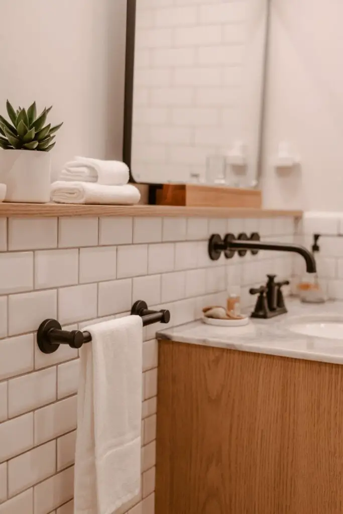 How to Incorporate Wood Accents into a Small Bathroom (Warmth, Style, and Zero Cabin Overload) 5 Mixing Wood with Other Materials
